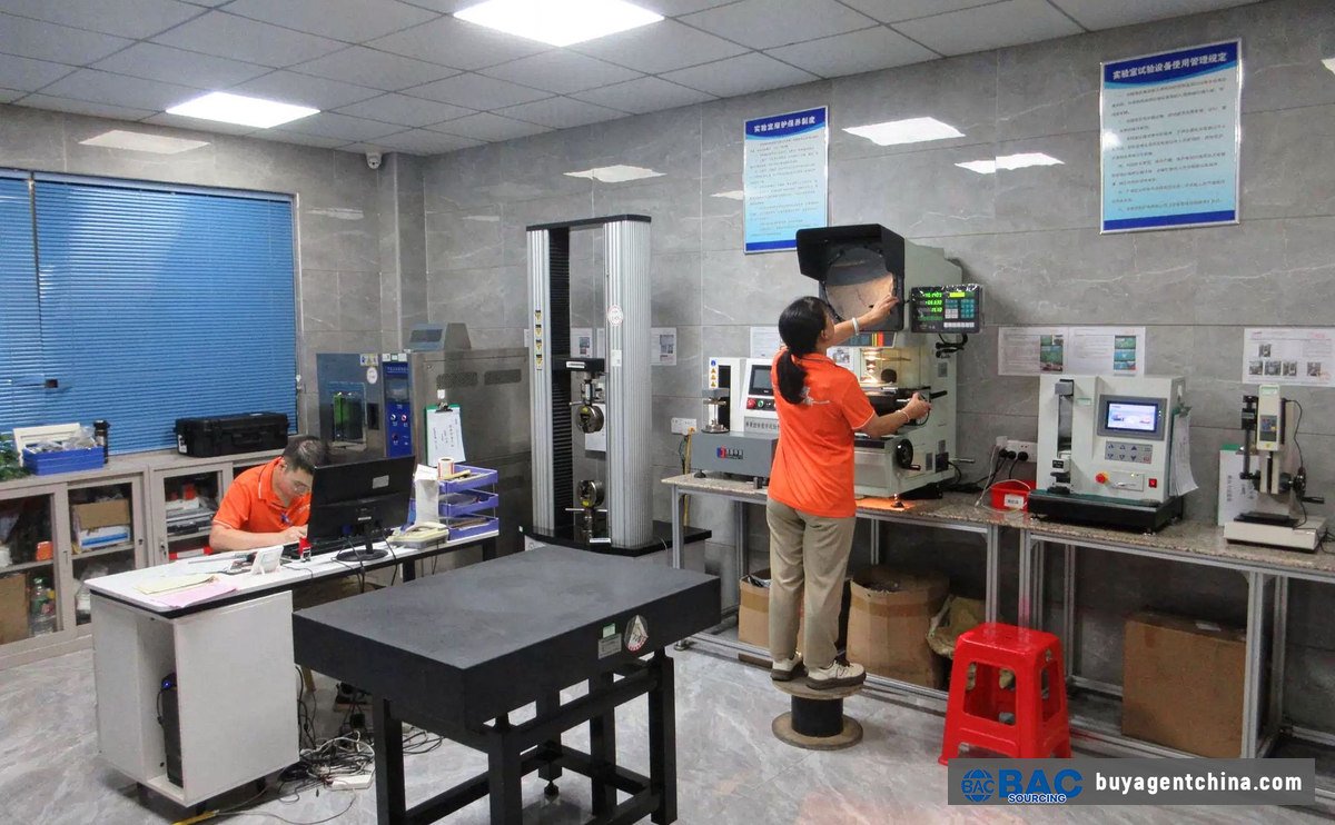 Materials testing machine in a testing laboratory — verify springs with tools, not eyes