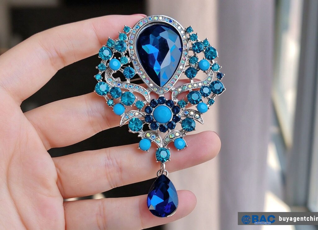 Crystal flower brooch with pendant drop — premium rhinestone tier